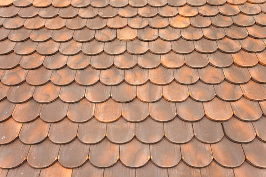 detail of  a tiled roof from a mountain house in Val di Funes (Italy)