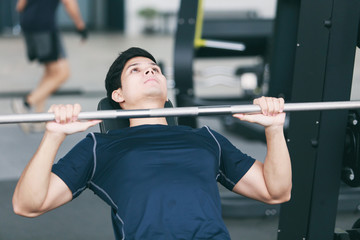 man exercising in fitness gym for good health.