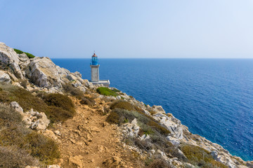 Fototapeta na wymiar Lighthouse at cape Tainaron lighthouse in Mani Greece. Cape Tenaro, (Cape Matapan) is the southernmost point of mainland Greece.