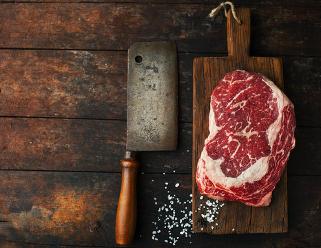 Raw fresh ribeye steak with salt