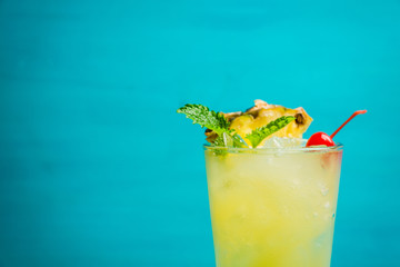 Sweet cocktail with pineapple and rum. Selective focus.