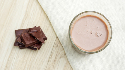 Chocolate milk on a wooden table.