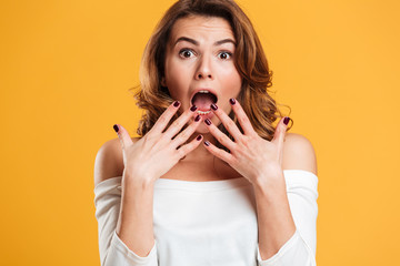 Excited shocked young woman