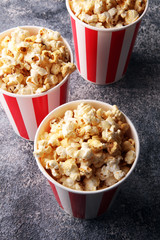 Cinema concept with popcorn in red white bag