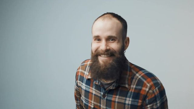 Hipster bearded man feeling joy celebrating success emotionally