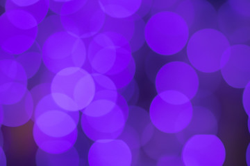 Photo of purple bokeh in the city at night. Effect light texture and design. Soft focus and blur background.