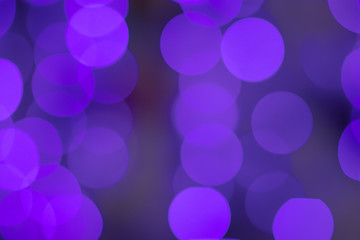Photo of purple bokeh in the city at night. Effect light texture and design. Soft focus and blur background.