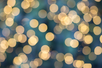 Photo of bokeh in Merry Christmas and Happy new year’s Day. Effect golden light texture and design. Soft focus and blur green background.