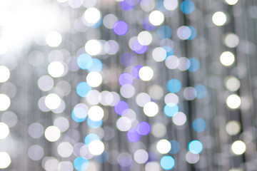 Obraz premium Photo of colorful bokeh lights in the City at night. Effect golden light texture and design. Soft focus and blur background.