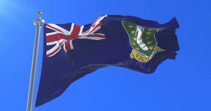 Flag of the British Virgin Islands waving at wind with blue sky, loop