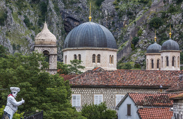 Fototapeta na wymiar Domes of Orthodox Saint Nicholas Church on the Old Town of Kotor, Montenegro. View from historic ramparts
