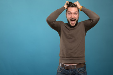 Naklejka premium Casual young man expressing anger and irritation