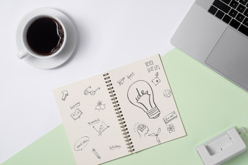 Business ideas, creativity, inspiration and start up concepts, ideas message on notebook with lightbulb.