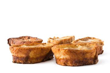 Traditional homemade Spanish torrijas isolated on white background. Easter dessert.