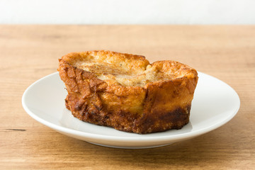 Traditional homemade Spanish torrijas on wooden  background. Easter dessert.