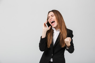 Happy lady screaming and showing winner gesture isolated