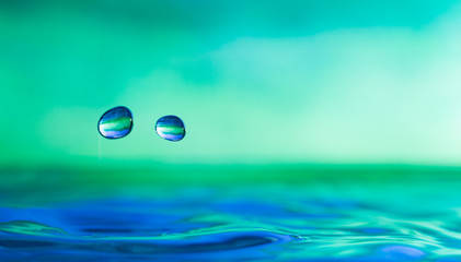 Naklejka na ściany i meble Colorful water droplet splash photograph