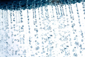 Fototapeta na wymiar Shower and falling water drops.