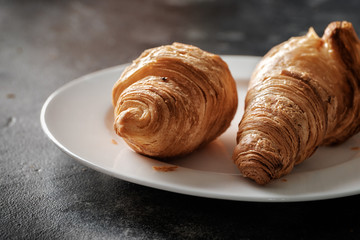Several croissants on a plate close up