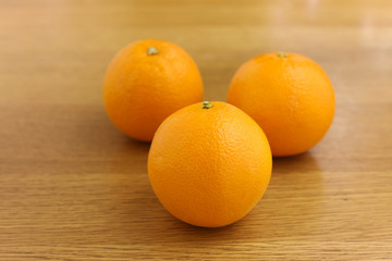 Fresh orange on wooden table
