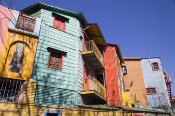 Buenos Aires, Argentina - August 16, 2017: Busy street with colorful houses and terraces near Caminito in La Boca