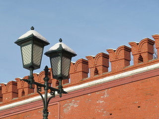 Fototapeta na wymiar Steet lamps on the background of the Kremlin wall in Moscow