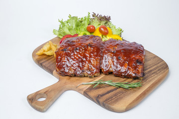 Pork ribs barbecue served with fresh salad and french fried