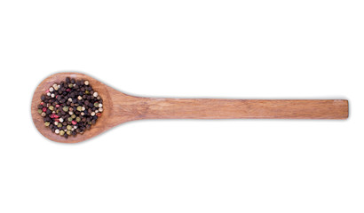 Mix of different Colorful dried  peppers balls on wooden spoon isolated on white background