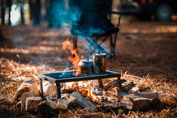 Old teapot boils on campfires