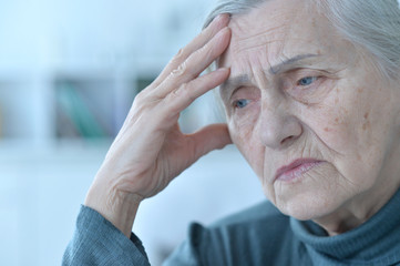  beautiful sad elderly woman close-up