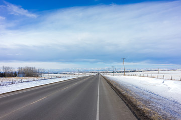 Alberta Rural Road with Mountains in the Horizon