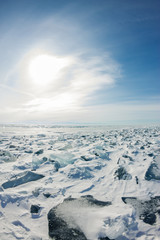 Panorama of the blue hummocks of Lake Baikal at sunset