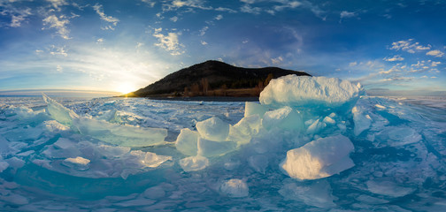 Woman in blue hummocks of the ice Baikal at sunset. Spherical vr 360 180 degrees panorama