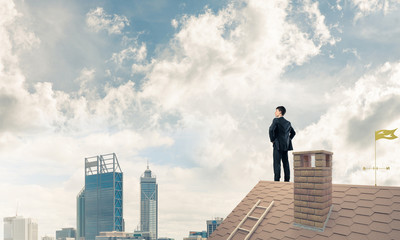 Mister boss on brick roof with arms akimbo. Mixed media
