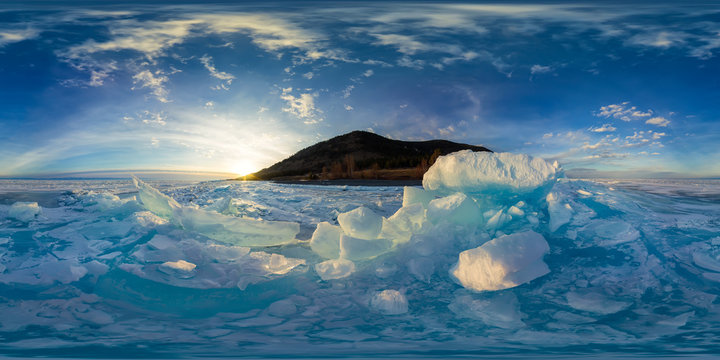 Woman in blue hummocks of the ice Baikal at sunset. Spherical vr 360 180 degrees panorama