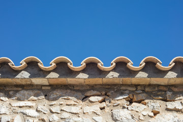 Detail of clay roof tiles from a mediterranean country house on a sunny day