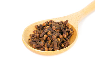 cloves on a wooden spoon