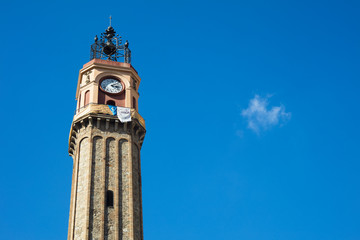 Fototapeta na wymiar Watch tower in Vila de Gracia Square in Barcelona, Catalonia, Spain