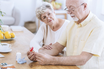 Worried wife supporting sick husband