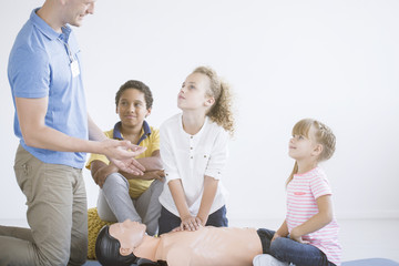 Paramedic praising young boy