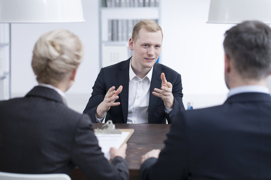 Young businessman convincing head manager