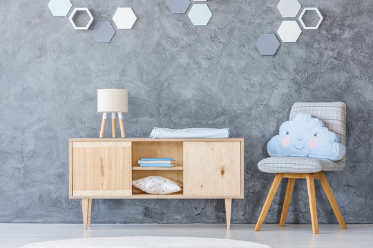 Shelf and chair in baby room