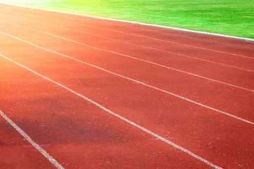 Fototapeta premium Red running track, white line in the stadium