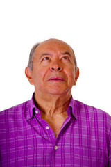 Portrait of a happy mature man wearing a purple square t-shirt in a blurred background
