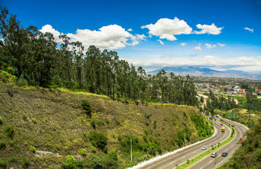 Fototapeta na wymiar Aerial view of road in the mountains to visit the municipal dump in the city of Quito, Ecuador
