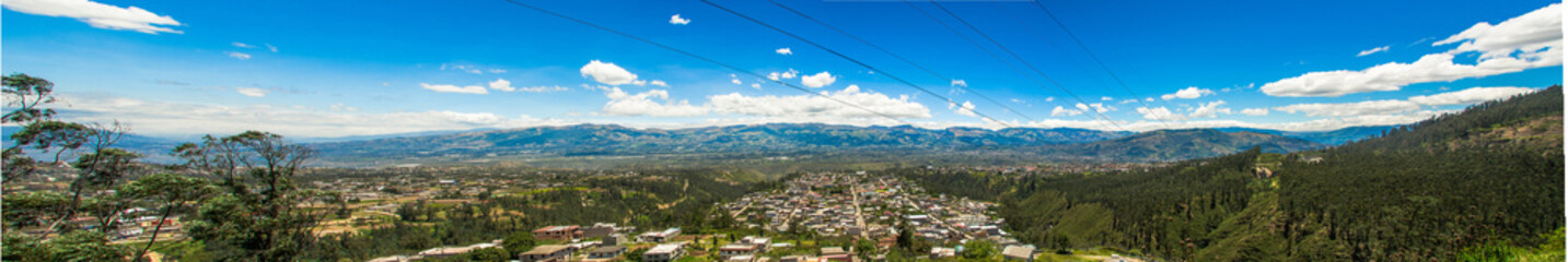 Beautiful panaramic view of buildings surrounding of mountains, to visit municipal dump in a beautiful day, in the city of Quito, Ecuador