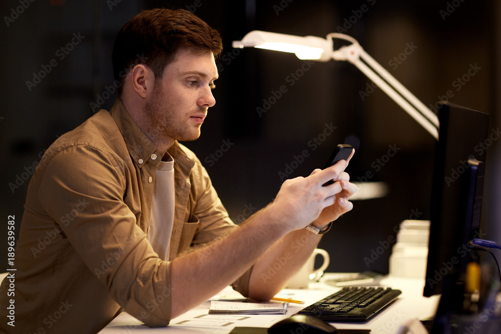 Canvas Prints man with smartphone working late at night office