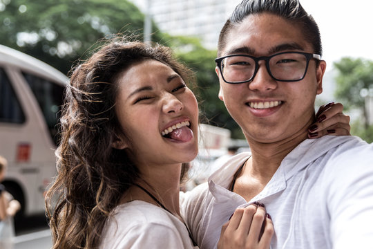 Young Asian Couple Taking Selfie