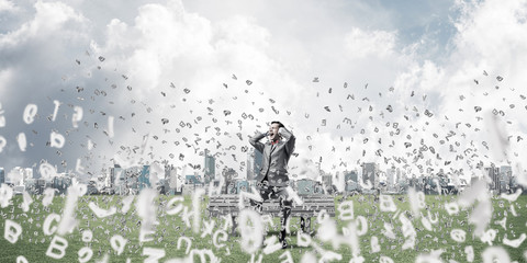 Young man on bench in summer park cant hear the sound