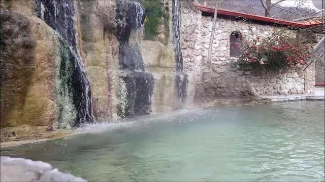 Waterfall and pool with thermal spring at Loutra Pozar of Aridaia in Macedonia, Greece